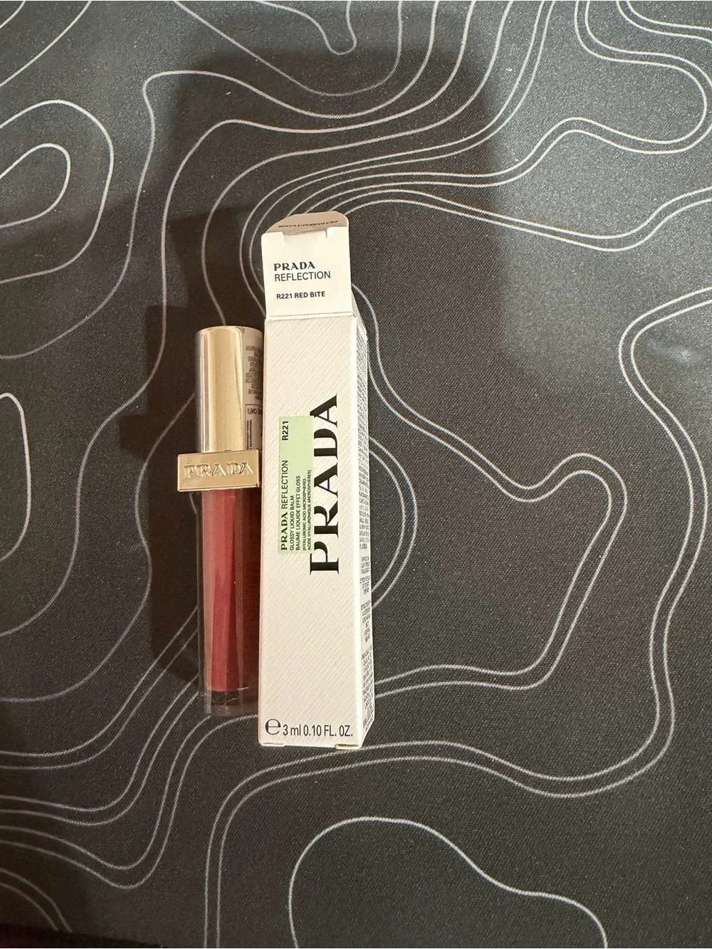 Prada Reflection Lip Color R221 Red Bite - Prada Red Lip Tint